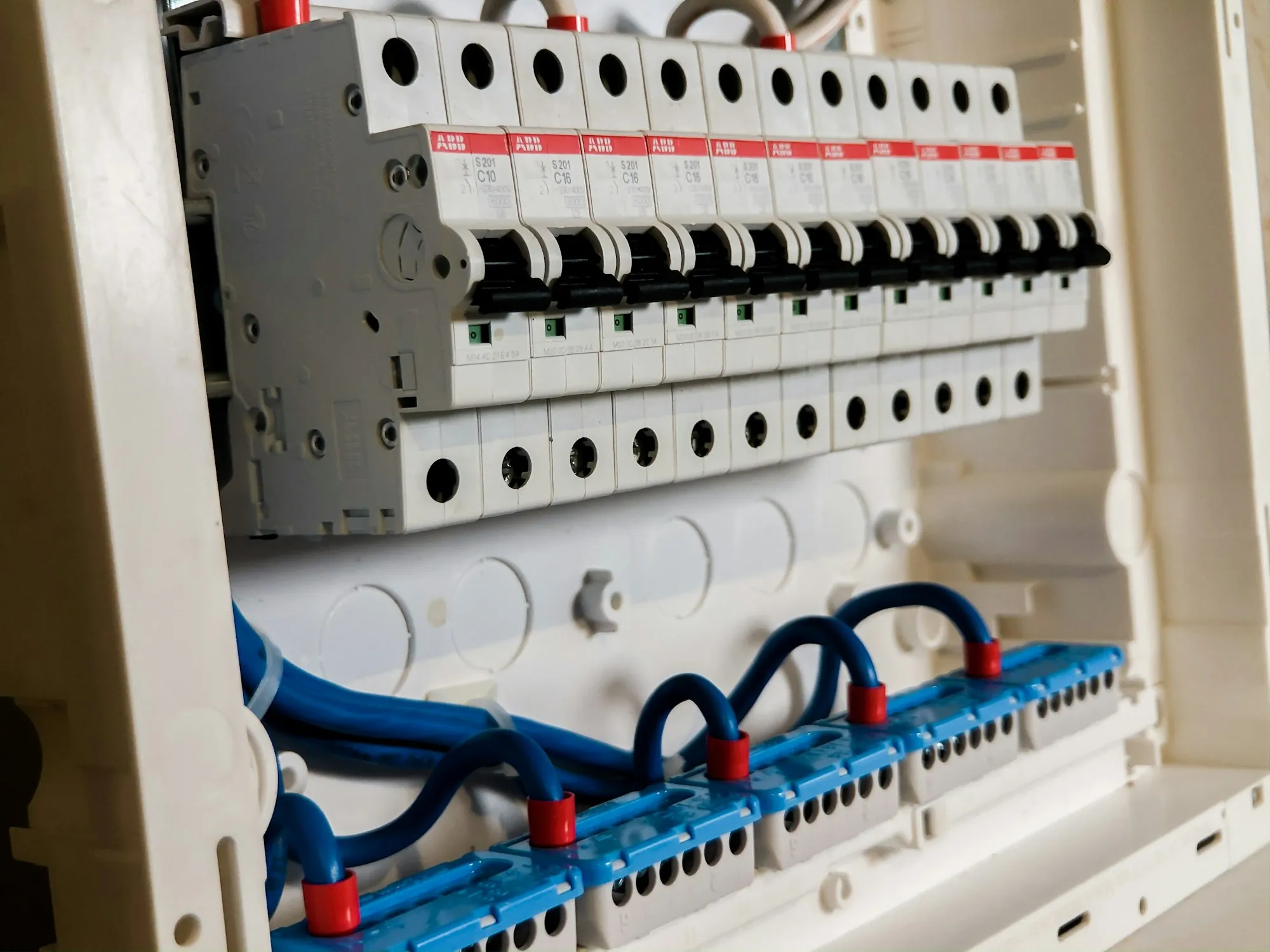 Close view of a modern breaker panel with labelled circuits